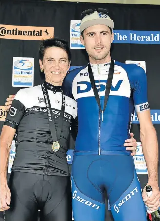  ?? Picture: EUGENE COETZEE ?? POWER PAIR: Yolande de Villiers and Gert Heyns celebrate on the podium after winning the women’s and men’s sections at The Herald Continenta­l Cycle Tour 80km MTB race yesterday which started and ended at the Addo Polo Club