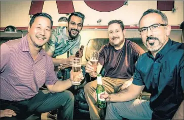  ?? Ryan D. Middleton ?? HAMMER & NAILS CEO John Choi, left, enjoys a beer with friends Nikhil Patel, Chris Drevno and Ashkan Alizadeh at his company’s grooming salon in Folsom, Calif. The chain plans to open 14 more salons this year.