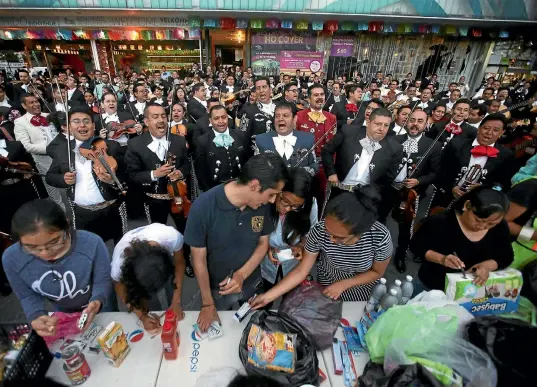  ?? REUTERS ?? Mariachi musicians perform in Mexico City’s Garibaldi Square yesterday to encourage people to donate supplies to help the victims of Mexico’s devastatin­g earthquake.