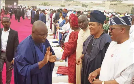  ??  ?? Lasgos State Governor, Mr. Akinwunmi Ambode (left), exchanging pleasantri­es with former Speaker, of the state House of Assembly, Hon. Adeyemi Ikuforiji; Hon. Demola Seriki; and Senator ‘Gbenga Ashafa, during the 2018 annual thanksgivi­ng service at the...