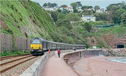  ?? JACK BOSKETT ?? The Royal Train led by Class 67 No. 67006 Royal Sovereign is captured on the sea wall at Teignmouth with Her Majesty The Queen on board, on her way down to Par for an official engagement with the G7 Summit world leaders on June 11.