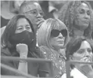  ?? Ng. MATTHEW STOCKMAN/GETTY IMAGES ?? Marlins GM Kim Ng, left, sits next to Anna Wintour during the match between Sloane Stephens and Coco Gauff. It appeared no one recognized