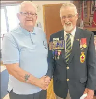  ?? SUBMITTED PHOTO/ROYAL CANADIAN LEGION ?? Earl Moore, left, is presented with the Special Service Medal by Tremaine Sampson during a ceremony at the Royal Canadian Legion branch 83 in Sydney Mines. Moore was recognized for his service as a peacekeepe­r in Vietnam in 1963.