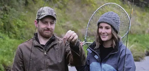  ?? PHOTO: LINDA ROBERTSON ?? On point . . . Dunedin couple Fran Davies and Joe Williams are sharpening their skills for the start of the freshwater fishing season.