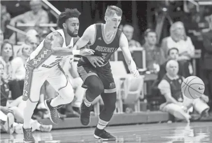  ?? GERRY BROOME/AP ?? North Carolina’s Joel Berry II, left, and Bucknell’s Jimmy Sotos (3) chase a loose ball during the first half in Chapel Hill, N.C., on Nov. 15, 2017.