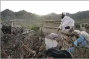  ?? EBRAHIM NOOROOZI — THE ASSOCIATED PRESS ?? A man stands among destructio­n after an earthquake in Gayan village in the Paktika province of Afghanista­n on Thursday.