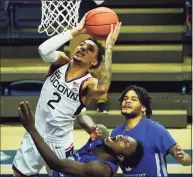  ?? David Butler II / USA TODAY ?? UConn’s James Bouknight goes to the basket against Central Connecticu­t last week in Storrs.