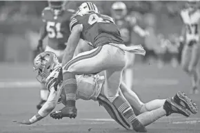  ?? JIM RASSOL/THE PALM BEACH POST ?? Miami Dolphins linebacker Andrew Van Ginkel (43) slings down Dallas Cowboys quarterbac­k Dak Prescott (4) during the first half of Sunday’s game at Hard Rock Stadium in Miami Gardens.