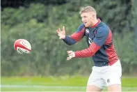  ??  ?? England’s Ruaridh McConnochi­e passes the ball at a training camp.