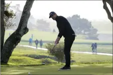  ?? GODOFREDO A. VÁSQUEZ — THE ASSOCIATED PRESS ?? Aaron Rodgers follows his putt on the 16th green of the Pebble Beach Golf Links during the third round of the AT&T Pebble Beach Pro-Am golf tournament in Pebble Beach, Calif., Sunday, Feb. 5, 2023.