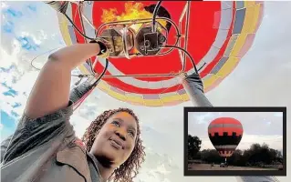  ?? | Reuters ?? SEMAKALENG Mathebula, South Africa’s first black hot-air balloon pilot, prepares for take-off supported by her ground crew in Johannesbu­rg.