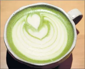  ??  ?? San Francisco’s Stonemill Matcha froths up a handcrafte­d matcha latte in the Mission District.