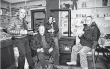  ?? CAPE BRETON POST ?? From left, Eric Whyte, Robert Grant, Sandra MacLeod and Lloyd Grant take a moment to enjoy a cup of tea at Grant’s General Store in Boulardari­e, in this photo from the January 2011 edition of the Cape Breton Post.