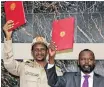  ??  ?? GENERAL Mohamed Hamdan Dagalo, Deputy Head of the Sudan Transition­al Military Council and Alhadi Idris, Chairman of the Sudanese Revolution­ary Front, hold the agreement on peace and ceasefire during the signing ceremony in Juba in October last year. | ANA Archives