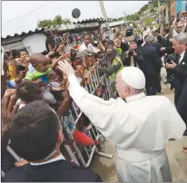  ?? AP PHOTO ?? Pope Francis’ greets people at his arrival at the San Francisco neighborho­od in Cartagena, Colombia.