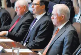  ?? Evan Vucci ?? The Associated Press Attorney General Jeff Sessions listens Monday as President Donald Trump speaks during a Cabinet meeting at the White House.