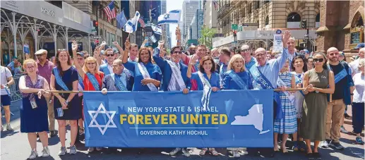  ?? (Perry Bindelglas­s) ?? PARTICIPAN­TS AT the Celebrate Israel Parade include the author, the grand marshal of the event, at the front and center flanked by the governor of the State of New York Kathy Hochul to the immediate right and state Attorney-General Letitia James to the immediate left. Also pictured in the front row are Rep. Carolyn Maloney (D-NY) and Rep. Jerry Nadler (D-NY).