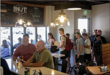  ?? PHOTOS BY KARL MONDON — STAFF PHOTOGRAPH­ER ?? Longtime Santa Clara University watering hole, The Hut, reopens for business in Santa Clara on Monday. The Hut, an institutio­n for 70 years, closed in late 2016.
