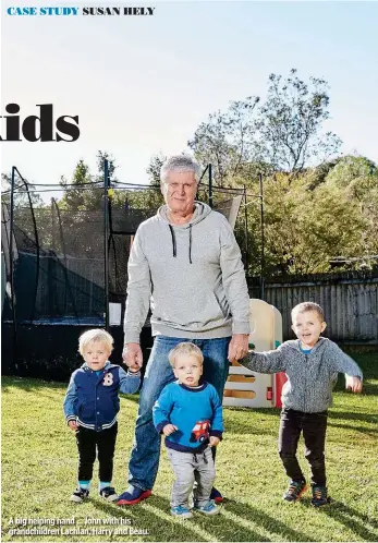  ??  ?? A big helping hand ... John with his grandchild­ren Lachlan, Harry and Beau.