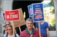  ?? ADAM FARENCE — DIGITAL FIRST MEDIA ?? Faculty picketed at 10 locations across campus Wednesday morning after months of failed talks between the union and state system of higher education.