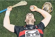  ??  ?? CHAMPS Hutchinson with sliotar after Munster final win