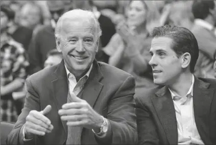  ?? ASSOCIATED PRESS ?? IN THIS JAN. 30, 2010, FILE PHOTO, Vice President Joe Biden (left) with his son Hunter at the Duke Georgetown NCAA college basketball game in Washington. Since the early days of the United States, leading politician­s have had to contend with awkward problems posed by their family members. Joe Biden is the latest prominent politician to navigate this tricky terrain.