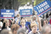  ?? PHOTOS BY DEBORAH CANNON / AMERICAN-STATESMAN ?? The crowd cheers along with a speaker at the rally. After the event, participan­ts visited lawmakers’ offices to advocate for favored legislatio­n.