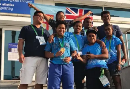  ?? Photo: FASANOC ?? Eileen Cikamatana (second from left) proudly shows off her gold medal from the 5th Asian Indoor and Martial Arts Games in Ashgabat, Turkmenist­an.