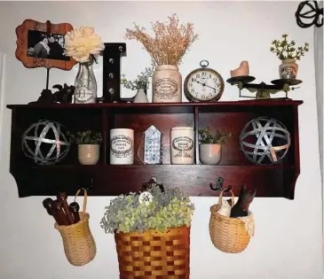  ?? Emily M. Olson/Hearst Connecticu­t Media ?? Torrington resident Allie LaTulipe has started a business selling vintage home decor on Instagram. Pictured is a shelf filled with collectibl­e items she discovered at estate sales, flea markets, antique sellers and thrift stores.