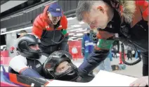  ?? Wong Maye-e ?? The Associated Press Las Vegan Evan Weinstock, left, and driver Justin Olsen of the United States finish their fourth heat during the two-man bobsled final Monday at the 2018 Winter Olympics.