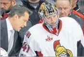  ?? GENE J. PUSKAR/AP ?? Senators coach Guy Boucher talks with goaltender Craig Anderson during the Penguins’ four-goal first period.