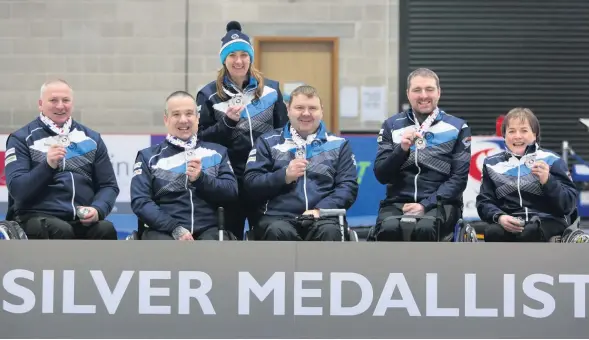  ??  ?? Happy Coach Sheila Swan (standing) with left to right :Gary Logan, Robert MacPherson, David Melrose, Hugh Nibloe and Aileen Neilson. Photo: WCF / Tom Rowland