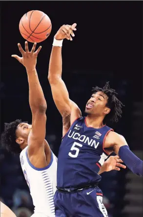  ?? DePaul Athletics / Contribute­d Photo ?? UConn’s Isaiah Whaley (5) fights for a rebound against DePaul in Chicago in January. Whaley will return for a fifth season the school announced on Tuesday.
