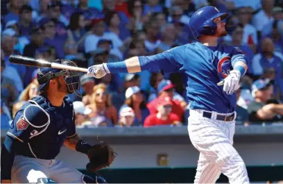  ?? | MATT YORK/ AP ?? Cubs leadoff hitter Ian Happ follows through on his sixth Cactus League home run Friday against the Brewers.