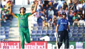  ??  ?? ABU DHABI: Pakistan’s Mohammad Irfan (L) reacts after delivering a ball as England’s Joe Root looks on during the second One Day Internatio­nal (ODI) cricket match between Pakistan and England at The Zayed Cricket Stadium in the Gulf Emirate of Abu...