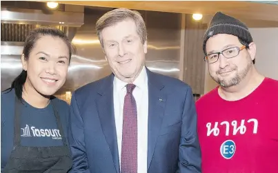  ??  ?? Chef Top Srisomphan, Mayor John Tory and Monte Wan