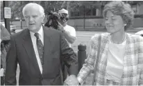  ?? Associated Press ?? This June 10, 1996, photo shows U.S. Rep. Joseph M. McDade, R-Scranton, Pa., left, holding hands with his wife, Sarah, as they enter the U.S. District Court in Philadelph­ia. McDade, an 18-term congressma­n who helped steer hundreds of millions of...