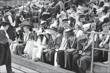  ?? PHOTO BY BOBBY MCMORRIS ?? 2017 YUMA HIGH SCHOOL TOP TEN SENIORS WORK ON THEIR LAST ASSIGNMENT in The Palace before Graduation Ceremonies at Doan Field last month.