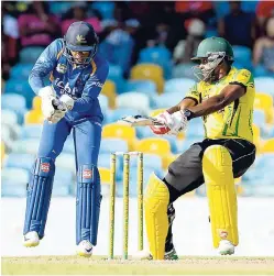  ?? WICB PHOTO ?? Jamaica’s Damion Jacobs cutting to the boundary during the Group ‘B’ match between Barbados Pride and Jamaica Scorpions in the WICB Super50 Tournament on Monday at Kensington Oval. The wicketkeep­er is Shane Dowrich.
