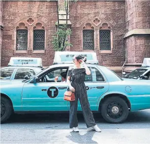  ??  ?? A New York taxi is painted Tiffany’s trademarke­d robin’s-egg blue in a May promotion.