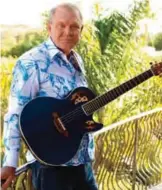  ??  ?? In this file photo, musician Glen Campbell poses for a portrait in Malibu, Calif. — AP