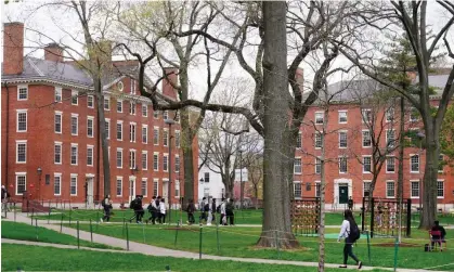  ?? Photograph: Charles Krupa/AP ?? Students walk through Harvard Yard in April 2022.