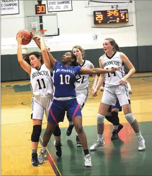  ??  ?? Burrillvil­le wing Morgan Bassett, left, attempts to grab a rebound in the second half of the No. 1 Broncos’ 58-38 Division III semifinal defeat to No. 5 Mount Pleasant Thursday night at Ponaganset.