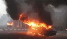 ?? AFP ?? A car burns during a ‘yellow vests’ protest near the Arc de Triomphe in Paris yesterday.