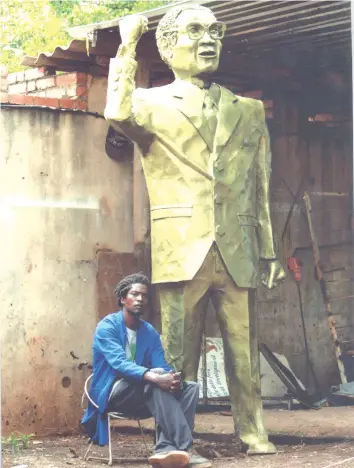  ??  ?? Mboya and President Mugabe’s statue