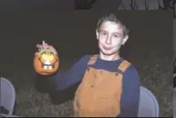  ?? PHOTO BY DIANNE BLANKENBAK­ER ?? While mom and dad get the wits scared out of them, kids can paint pumpkins in the family area of the haunted forest at Audubon Acres.