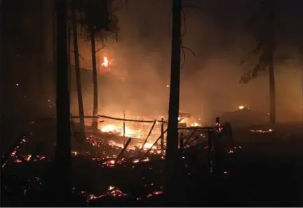  ?? WEST KELOWNA FIRE, THE CANADIAN PRESS ?? A fire burns in Lake Country, B.C. More evacuation orders were issued Saturday night as winds picked up in the Interior, jumping highways and threatenin­g to cut off escape routes. As many as 37,000 residents have been forced to leave their homes.