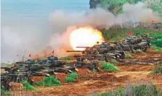  ?? AFP ?? US-made M60 A3 tanks are fired during the ‘Han Kuang’ lifefire drill, some 7 kms from the city of Magong on the outlying Penghu islands yesterday.