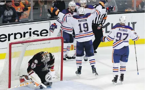  ?? CHRIS CARLSON/THE ASSOCIATED PRESS ?? Edmonton Oilers centre Mark Letestu, top left, celebrates after scoring a goal on Anaheim Ducks goaltender John Gibson during the third period of Game 1 of their second-round series on Wednesday in Anaheim, Calif. Letestu had two goals on the night.