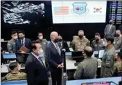  ?? PTI ?? US President Joe Biden, center, with South Korean President Yoon Suk Yeol, centre left, visits the Combat Operations Floor of the Osan Air Base, Sunday, in Pyeongtaek, South Korea